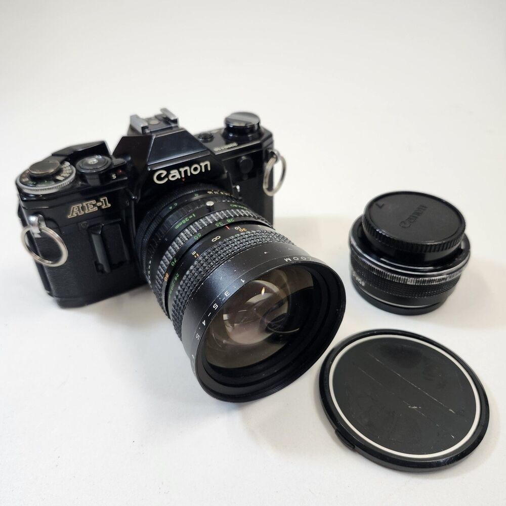 Canon AE-1 Black 35mm SLR Film Camera Sakar MC Zoom 1:3.5-4.5 f 28-80mm